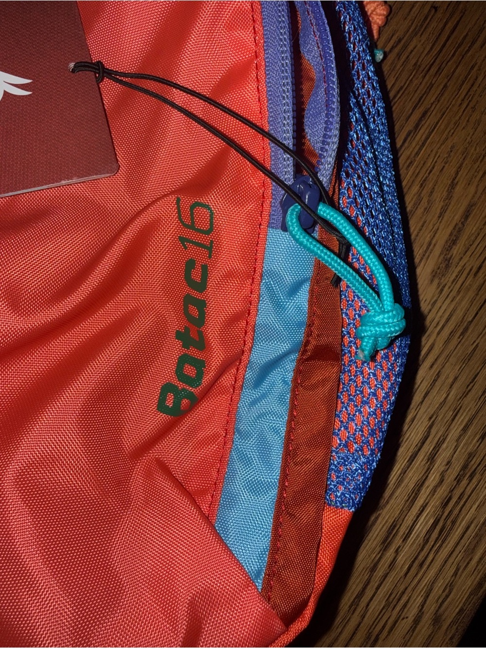 cotopaxi Camp Ada backpack in coral with blue and purple accents - Picture 2 of 4
